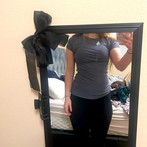 Fitted shirt! It’s like a grey blue color! it’s a size medium! 💙🩶